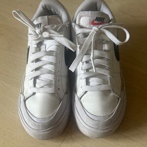 Nike Kids White Sneakers with Black Swoosh and Red Logo